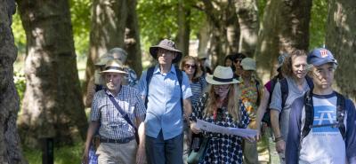 Group of people on a walk through a park