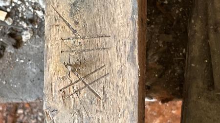 roman numerals etched into wood