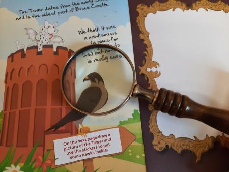 Family trail booklet with magnifying class