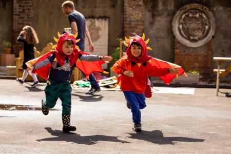 Boys in dragon costumes outside Bruce Castle Museum