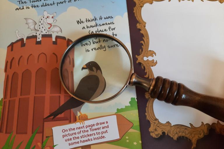 Family trail booklet with magnifying class