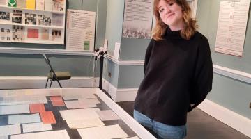 person in museum gallery