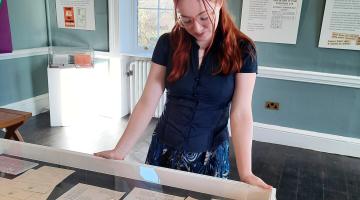 person in museum gallery