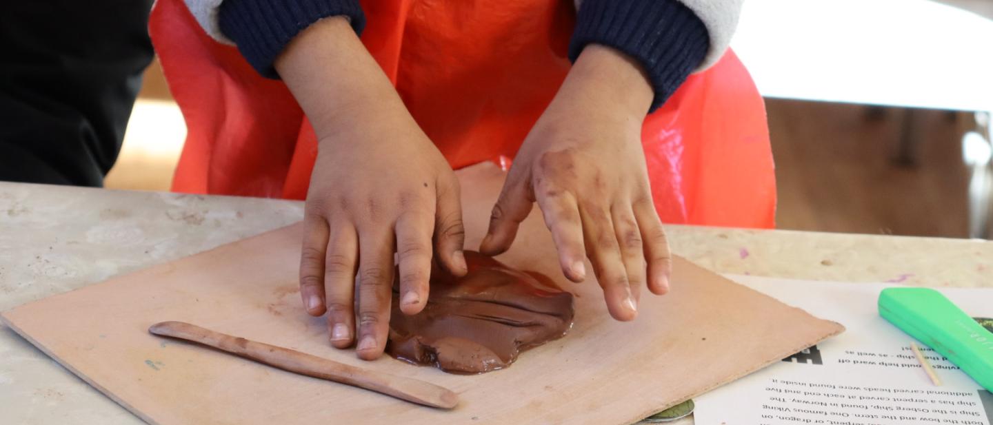 Child doing clay craft