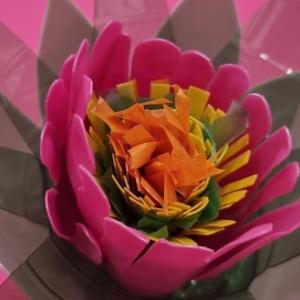 pink, orange and green flower made from recycled plastics