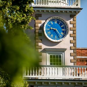 clocktower with foliage in foreground