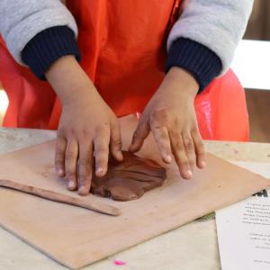 Child doing clay craft
